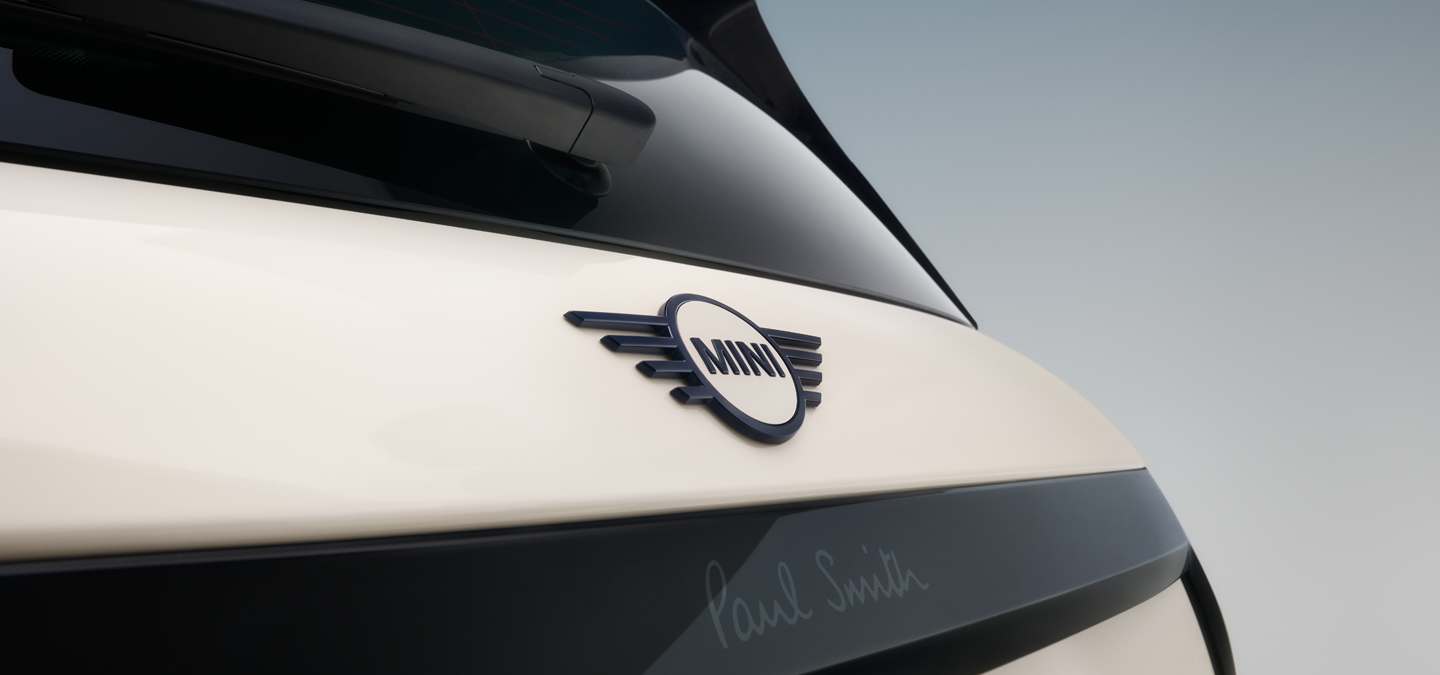 Close shot of the rear wing emblem of the all-electric MINI Cooper Paul Smith Edition in Inspired White