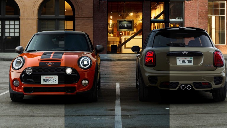 Two new MINI Cooper S hatches parked in front of a stylish looking cafe – one viewed from the front, the other from the rear. 